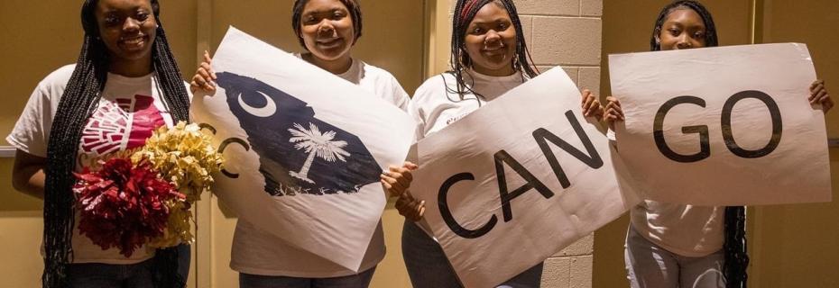 Students holding "SC Can Go" posters.